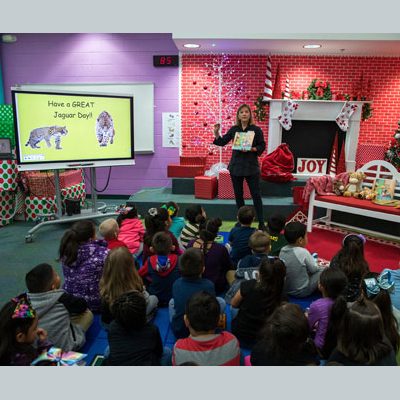 "Today we're going to learn about giraffes, authors and illustrators and read a story about three giraffes, Mildred, Seth and Emily," says Hatch.