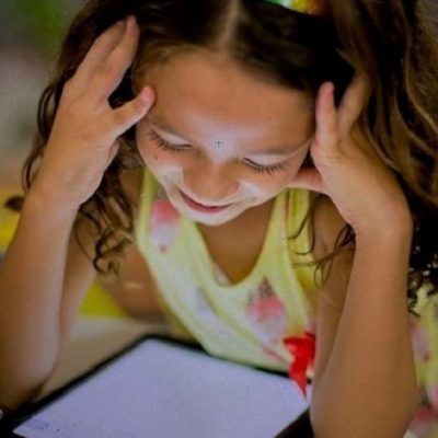 Girl reading on a electronic device