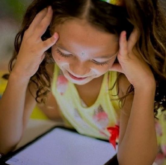 Girl reading on a electronic device